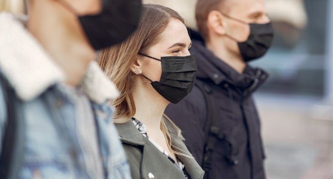 people-in-masks-stands-on-the-street